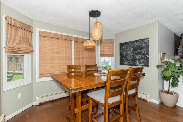 128 Santa Maria Dr, Torrington, CT 06790 - dining room with baseboard heating, a baseboard radiator, wood finished floors, and a textured ceiling