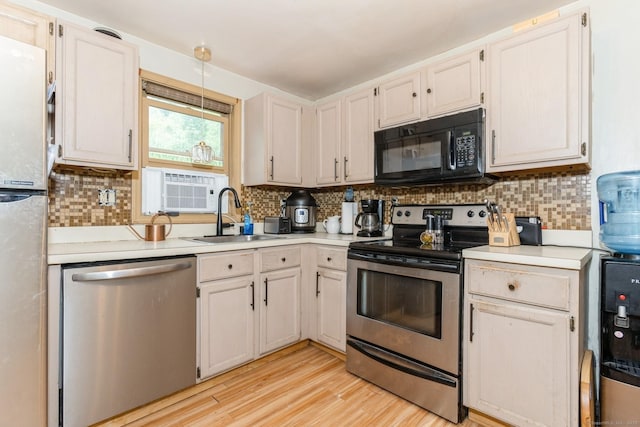 128 Santa Maria Dr, Torrington, CT 06790 - kitchen with stainless steel appliances, light countertops, and tasteful backsplash