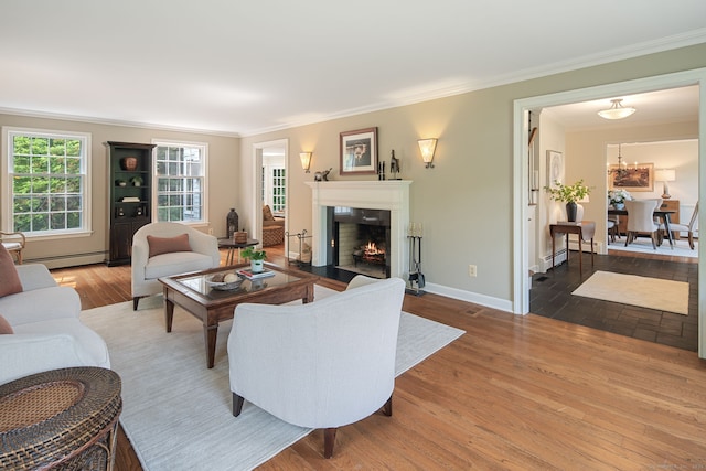 75 Bald Hill Rd, Wilton, CT 06897 - living area featuring ornamental molding, a baseboard heating unit, a fireplace with flush hearth, and wood finished floors