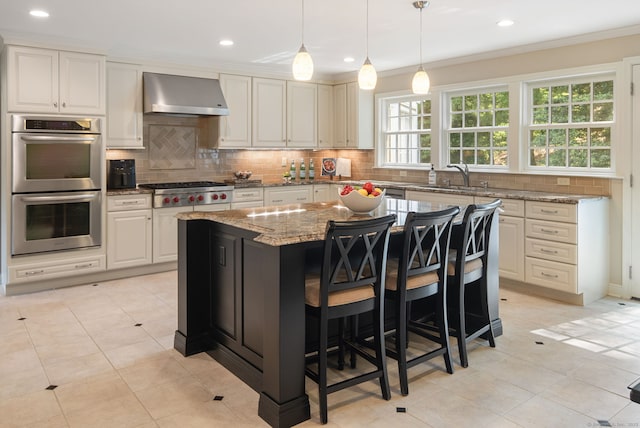 75 Bald Hill Rd, Wilton, CT 06897 - kitchen with wall chimney range hood, appliances with stainless steel finishes, light stone counters, backsplash, and crown molding