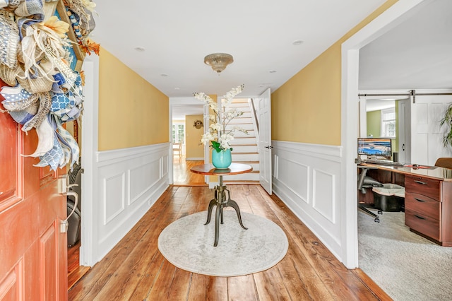 120 Huntington St, Shelton, CT 06484 - foyer featuring a wainscoted wall, light wood-type flooring, and stairs