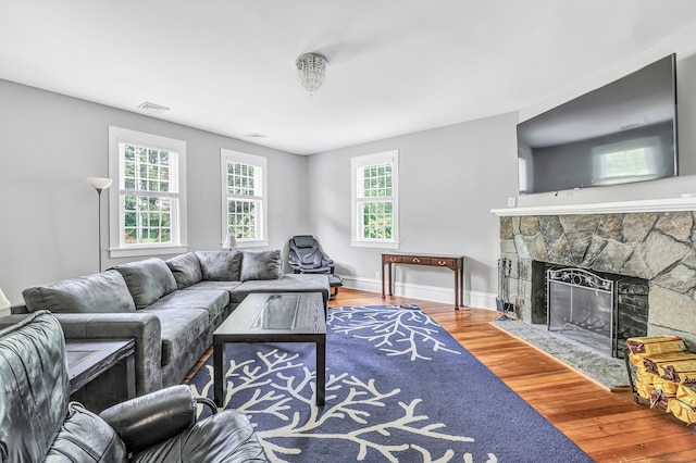 120 Huntington St, Shelton, CT 06484 - living room with wood finished floors, a fireplace, and baseboards