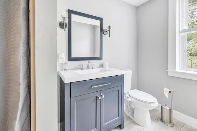120 Huntington St, Shelton, CT 06484 - full bathroom with toilet, vanity, tile patterned flooring, and baseboards