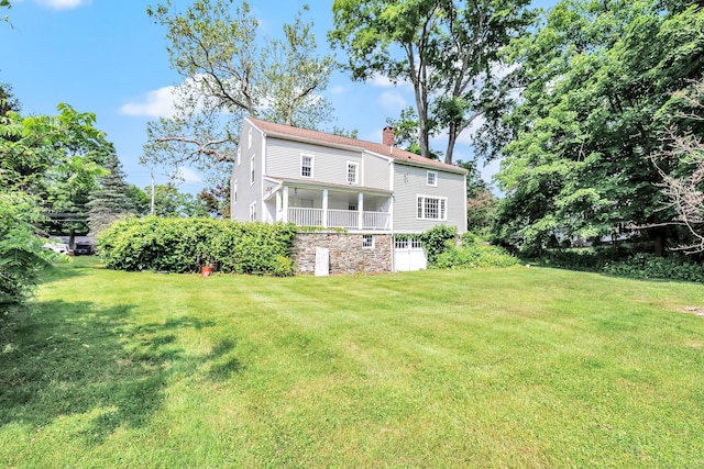 120 Huntington St, Shelton, CT 06484 - back of house featuring a chimney and a lawn