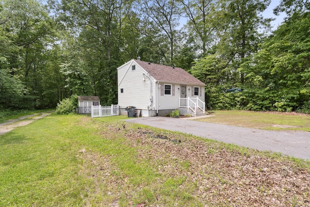 188 W Main St, East Lyme, CT 06357 - view of home's exterior featuring a storage unit