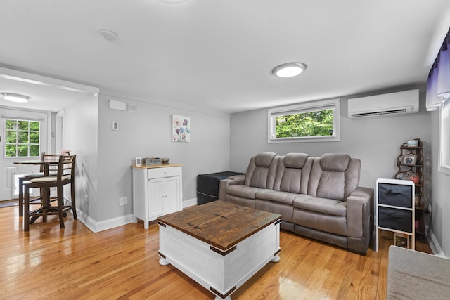 188 W Main St, East Lyme, CT 06357 - living area featuring a wall mounted AC and light wood finished floors