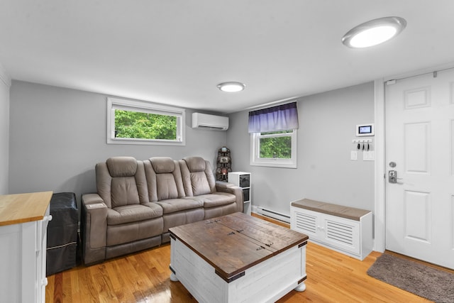 188 W Main St, East Lyme, CT 06357 - living area featuring a wall mounted AC, a baseboard radiator, light wood-style flooring, and healthy amount of natural light