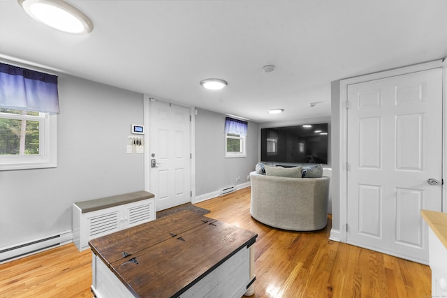 188 W Main St, East Lyme, CT 06357 - living room featuring a baseboard radiator and light wood-style floors