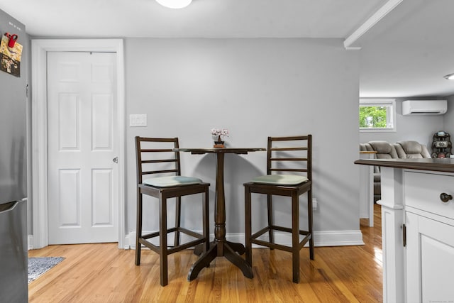 188 W Main St, East Lyme, CT 06357 - dining area featuring a wall mounted AC and light wood-style floors