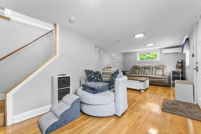 188 W Main St, East Lyme, CT 06357 - living room featuring a wall mounted AC and light wood-type flooring