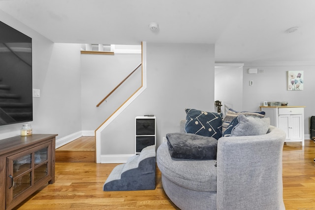 188 W Main St, East Lyme, CT 06357 - living area with stairway and light wood-type flooring
