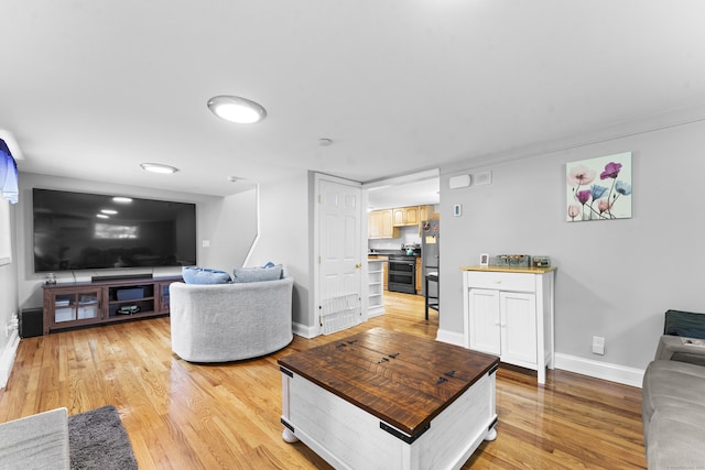 188 W Main St, East Lyme, CT 06357 - living room with light wood-style floors and baseboards