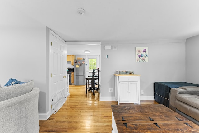 188 W Main St, East Lyme, CT 06357 - living room with light wood-type flooring and baseboards