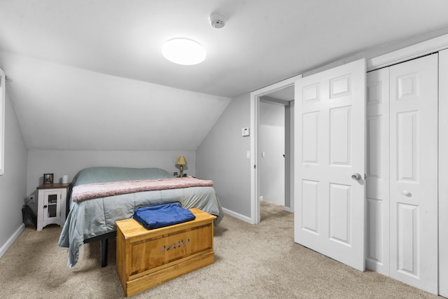 188 W Main St, East Lyme, CT 06357 - bedroom featuring light carpet, vaulted ceiling, and a closet