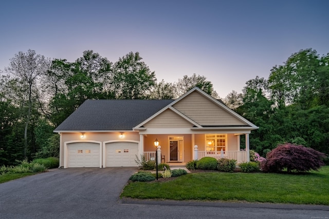 9 Benjamin Ln Unit 9, Tolland, CT 06084 - view of front of house with driveway, an attached garage, a porch, and a lawn
