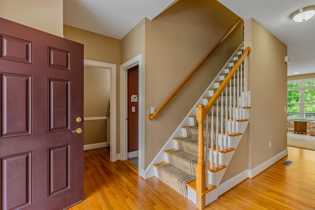 9 Benjamin Ln Unit 9, Tolland, CT 06084 - entryway featuring light wood-style flooring, baseboards, and stairs
