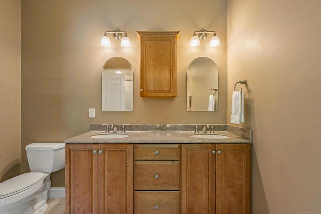 9 Benjamin Ln Unit 9, Tolland, CT 06084 - bathroom with double vanity, toilet, and tile patterned flooring