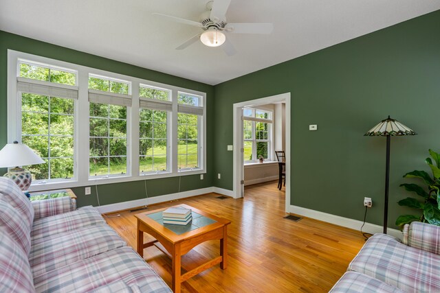 9 Benjamin Ln Unit 9, Tolland, CT 06084 - living area with baseboards, ceiling fan, and light wood-style floors