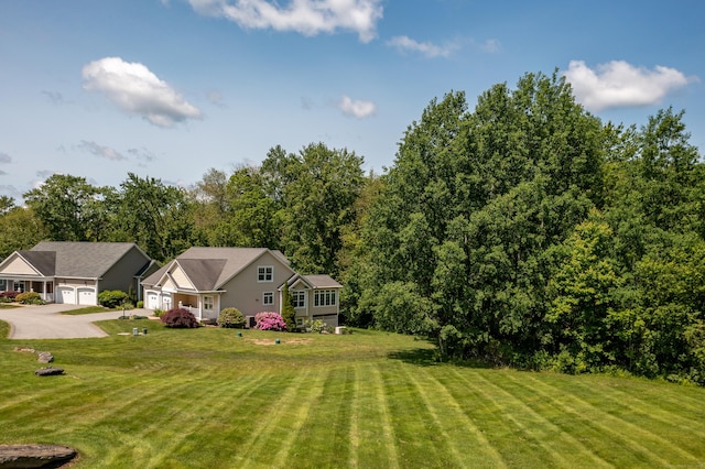 9 Benjamin Ln Unit 9, Tolland, CT 06084 - view of green lawn featuring an attached garage and driveway