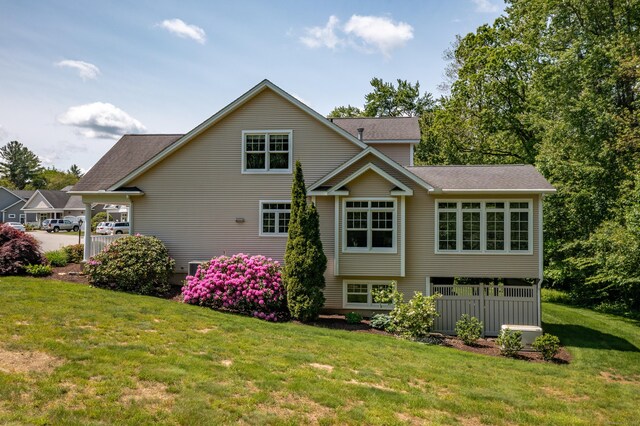 9 Benjamin Ln Unit 9, Tolland, CT 06084 - rear view of house featuring a yard and a shingled roof