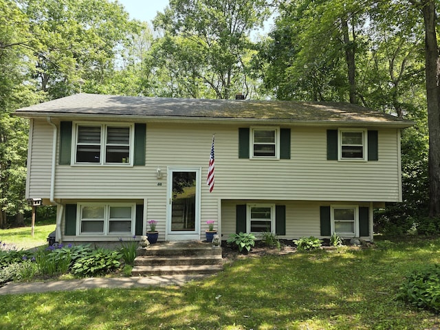 46 Richardson Hill Rd, Griswold, CT 06351 - raised ranch with a front lawn and view of wooded area