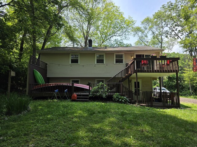 46 Richardson Hill Rd, Griswold, CT 06351 - back of house with a wooden deck, stairs, and a lawn