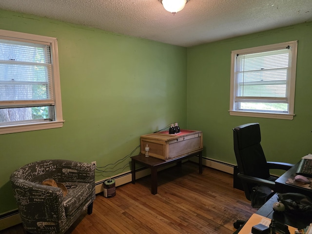 46 Richardson Hill Rd, Griswold, CT 06351 - office space featuring wood finished floors, healthy amount of natural light, baseboard heating, and a textured ceiling