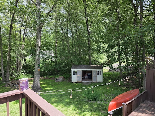46 Richardson Hill Rd, Griswold, CT 06351 - view of grassy yard featuring a storage unit and a deck