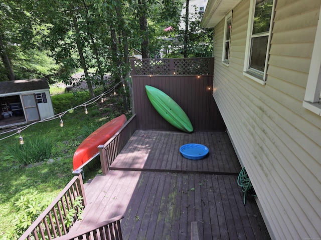 46 Richardson Hill Rd, Griswold, CT 06351 - wooden deck featuring a storage shed