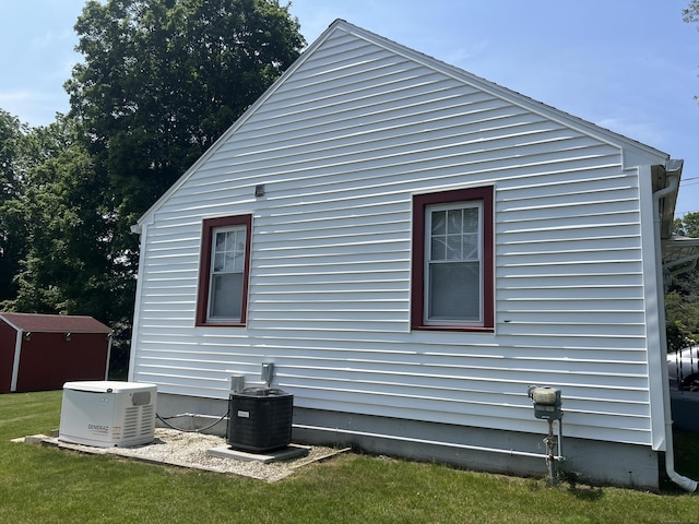 323 Harland Rd, Norwich, CT 06360 - view of home's exterior featuring central air condition unit and a yard