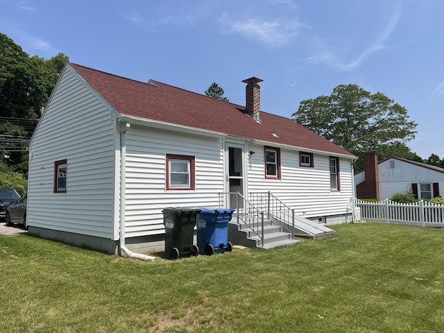 323 Harland Rd, Norwich, CT 06360 - rear view of house with a chimney and a shingled roof