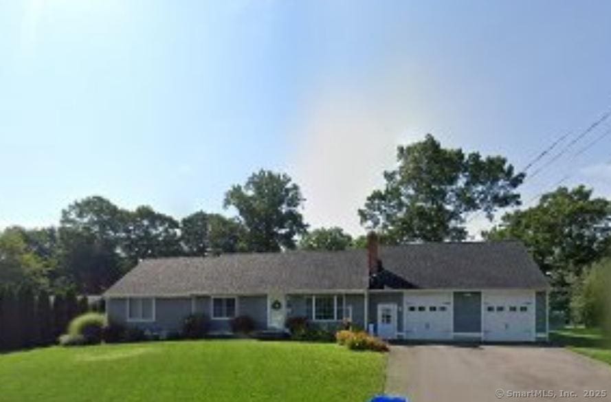 214 Rambler St, Bristol, CT 06010 - single story home featuring an attached garage, a front yard, driveway, and a chimney