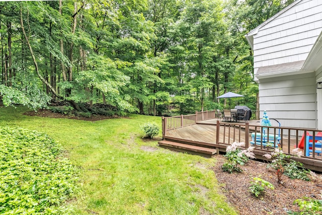 6 Buckboard Ln, Fairfield, CT 06824 - view of green lawn featuring outdoor dining space and a deck