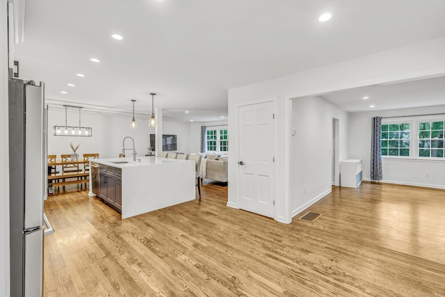 6 Buckboard Ln, Fairfield, CT 06824 - kitchen with open floor plan, freestanding refrigerator, light wood finished floors, healthy amount of natural light, and recessed lighting