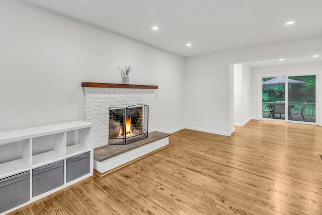 6 Buckboard Ln, Fairfield, CT 06824 - unfurnished living room featuring wood finished floors, a fireplace, and recessed lighting
