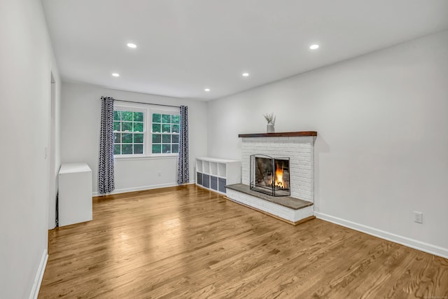 6 Buckboard Ln, Fairfield, CT 06824 - unfurnished living room with wood finished floors, a fireplace, and recessed lighting