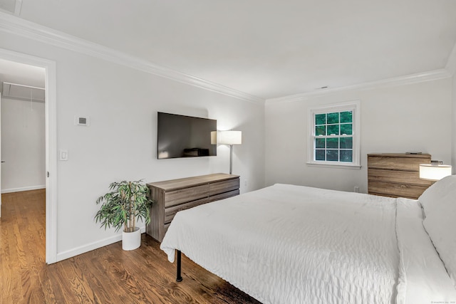 6 Buckboard Ln, Fairfield, CT 06824 - bedroom with crown molding, wood finished floors, attic access, and a walk in closet