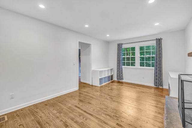 6 Buckboard Ln, Fairfield, CT 06824 - unfurnished living room with light wood-style flooring and recessed lighting