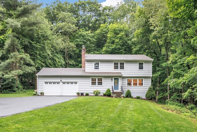 6 Buckboard Ln, Fairfield, CT 06824 - colonial inspired home featuring asphalt driveway, a chimney, a front yard, and a garage