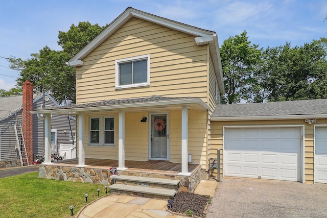 98 Herald Ave, Bridgeport, CT 06606 - view of front of house with a porch, roof with shingles, a garage, driveway, and a front lawn