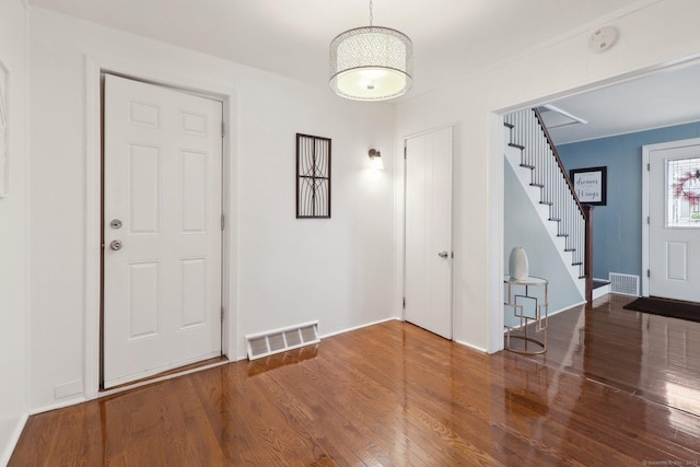 98 Herald Ave, Bridgeport, CT 06606 - entryway with wood finished floors, stairway, and baseboards