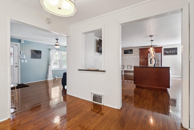 98 Herald Ave, Bridgeport, CT 06606 - unfurnished living room with wood finished floors, ornamental molding, and baseboards