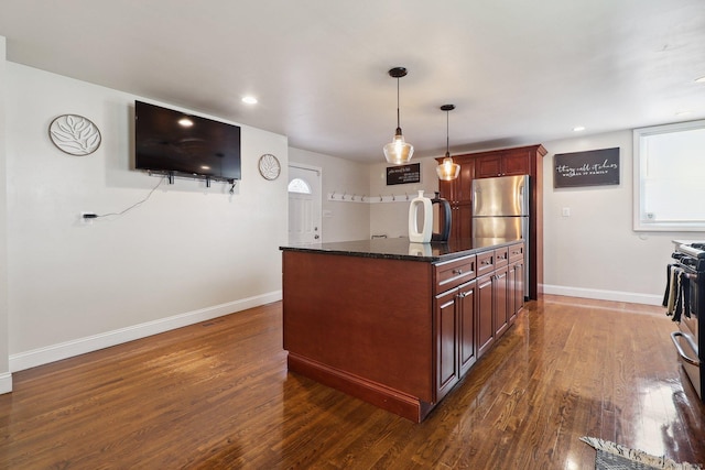98 Herald Ave, Bridgeport, CT 06606 - kitchen featuring dark wood finished floors, baseboards, freestanding refrigerator, decorative light fixtures, and recessed lighting