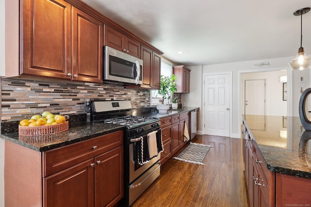 98 Herald Ave, Bridgeport, CT 06606 - kitchen featuring appliances with stainless steel finishes, dark wood-type flooring, tasteful backsplash, baseboards, and dark stone countertops