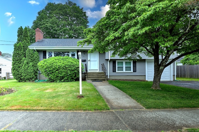 15 Edgemere Rd, Hamden, CT 06517 - view of front facade with driveway and a chimney