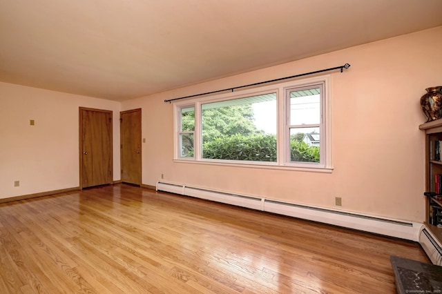 15 Edgemere Rd, Hamden, CT 06517 - unfurnished living room with a baseboard radiator and wood finished floors