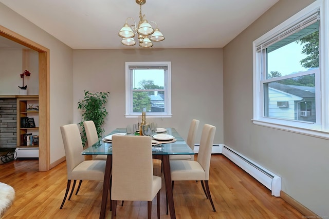 15 Edgemere Rd, Hamden, CT 06517 - dining room with a baseboard heating unit, healthy amount of natural light, light wood finished floors, and a chandelier