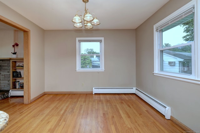 15 Edgemere Rd, Hamden, CT 06517 - spare room with a baseboard radiator, plenty of natural light, a baseboard heating unit, and a chandelier