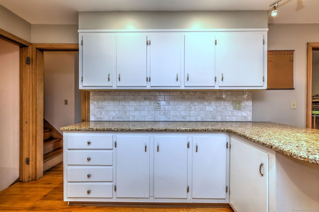15 Edgemere Rd, Hamden, CT 06517 - kitchen featuring tasteful backsplash, white cabinets, and light stone counters