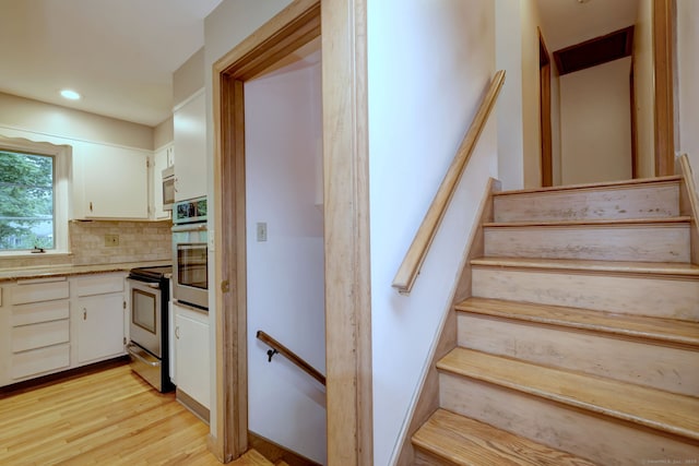 15 Edgemere Rd, Hamden, CT 06517 - stairs featuring wood finished floors and recessed lighting